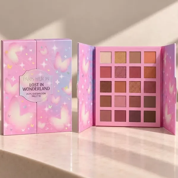 Paris Hilton Paleta de 25 Sombras: estuche rosa abierto con las sombras en tonos cálidos